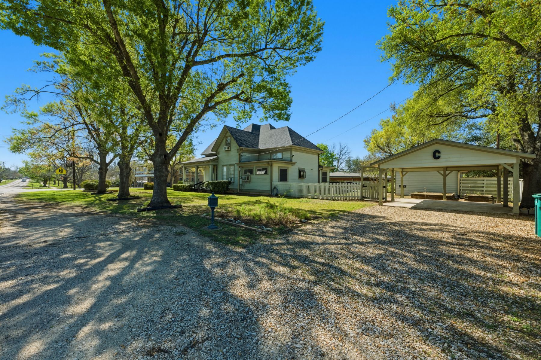 100 West 11th Street Elgin, TX 78621 - Photo 25 of 32 a front view of a house with a yard