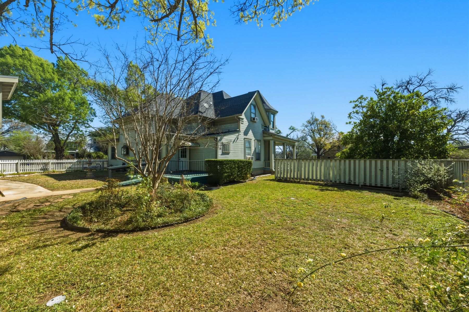 100 West 11th Street Elgin, TX 78621 - Photo 29 of 32 a view of backyard with swimming pool and seating space
