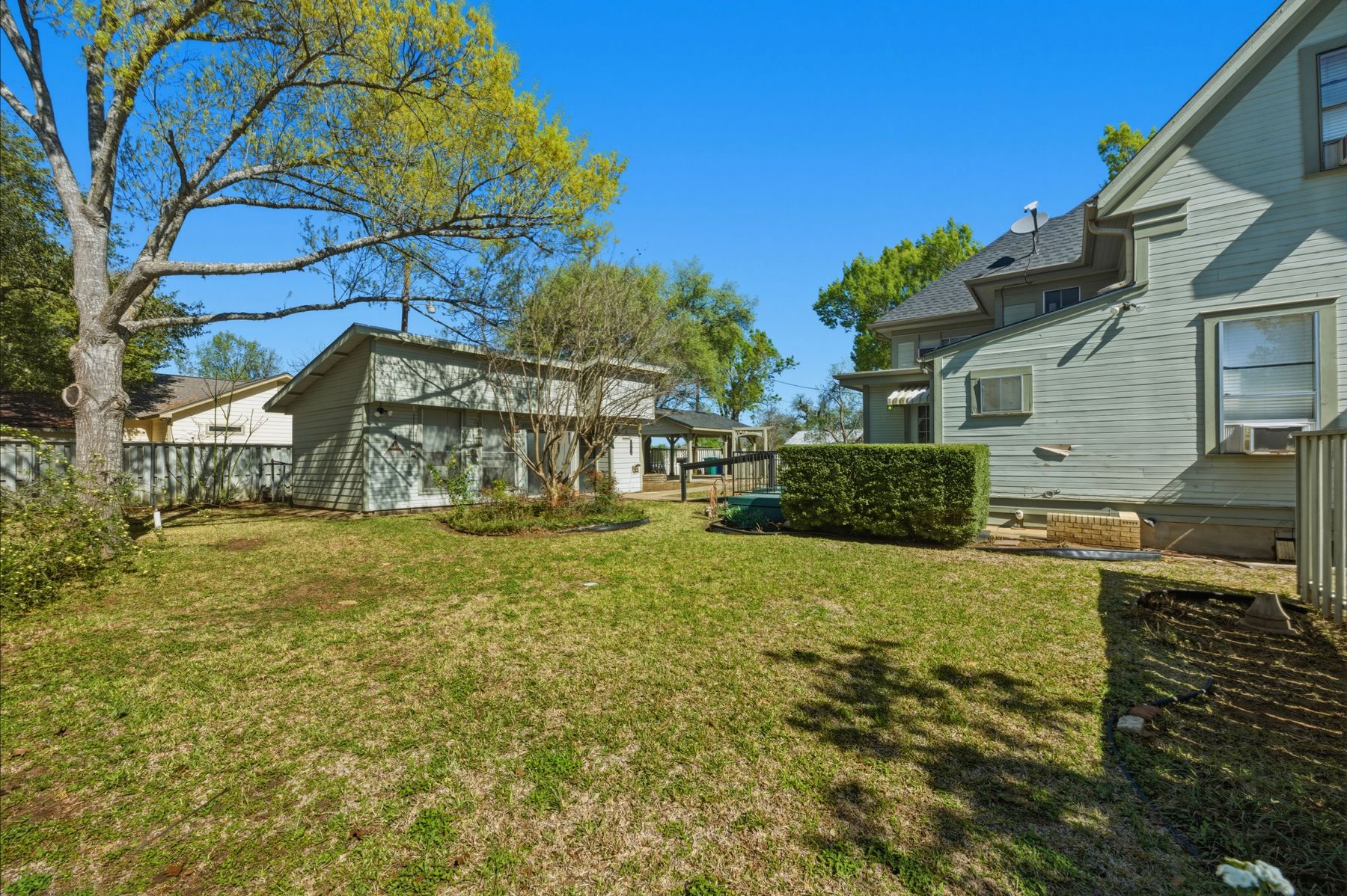 100 West 11th Street Elgin, TX 78621 - Photo 31 of 32 a view of a house with a yard