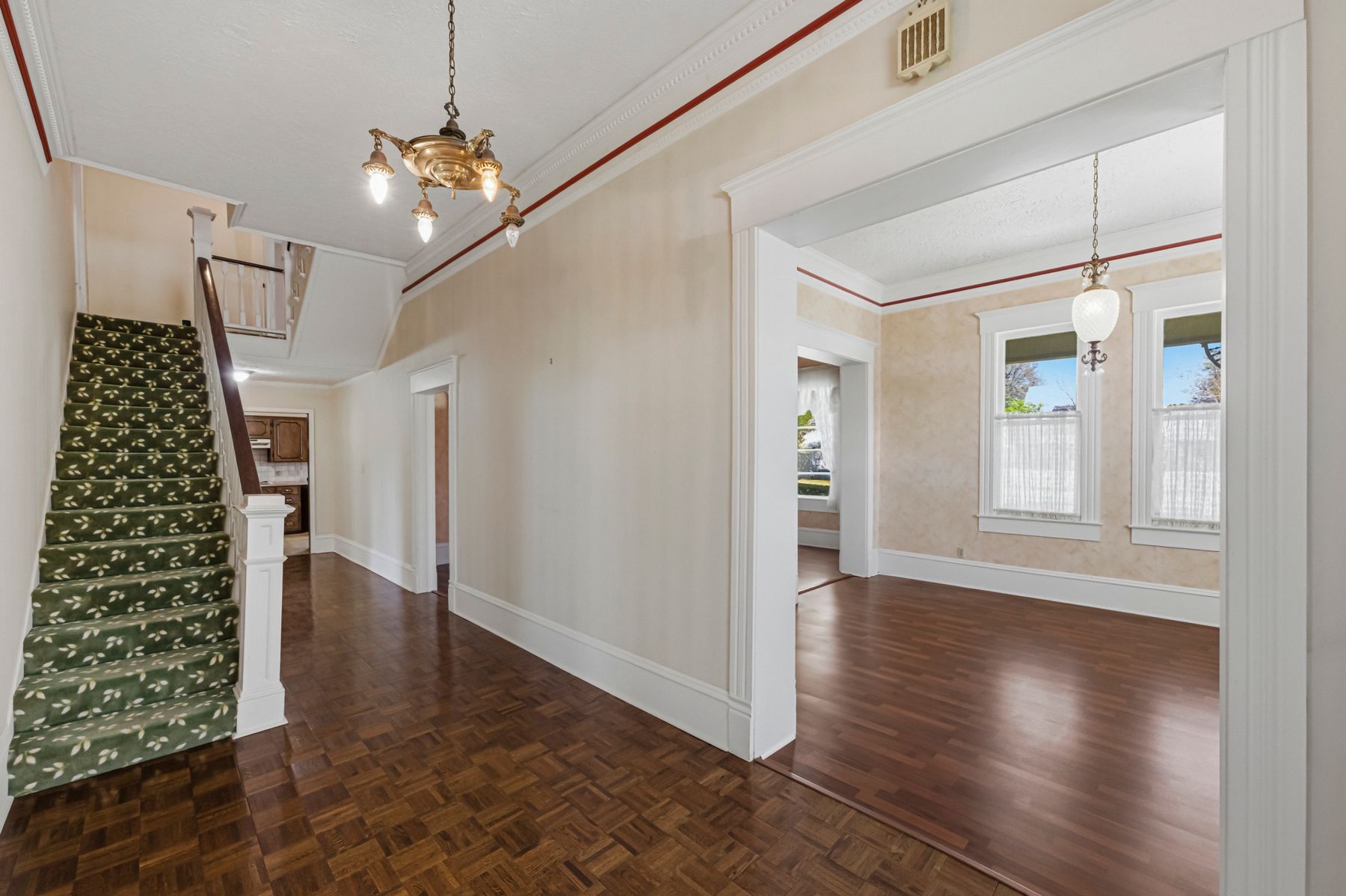 100 West 11th Street Elgin, TX 78621 - Photo 7 of 32 wooden floor in an empty room with a window