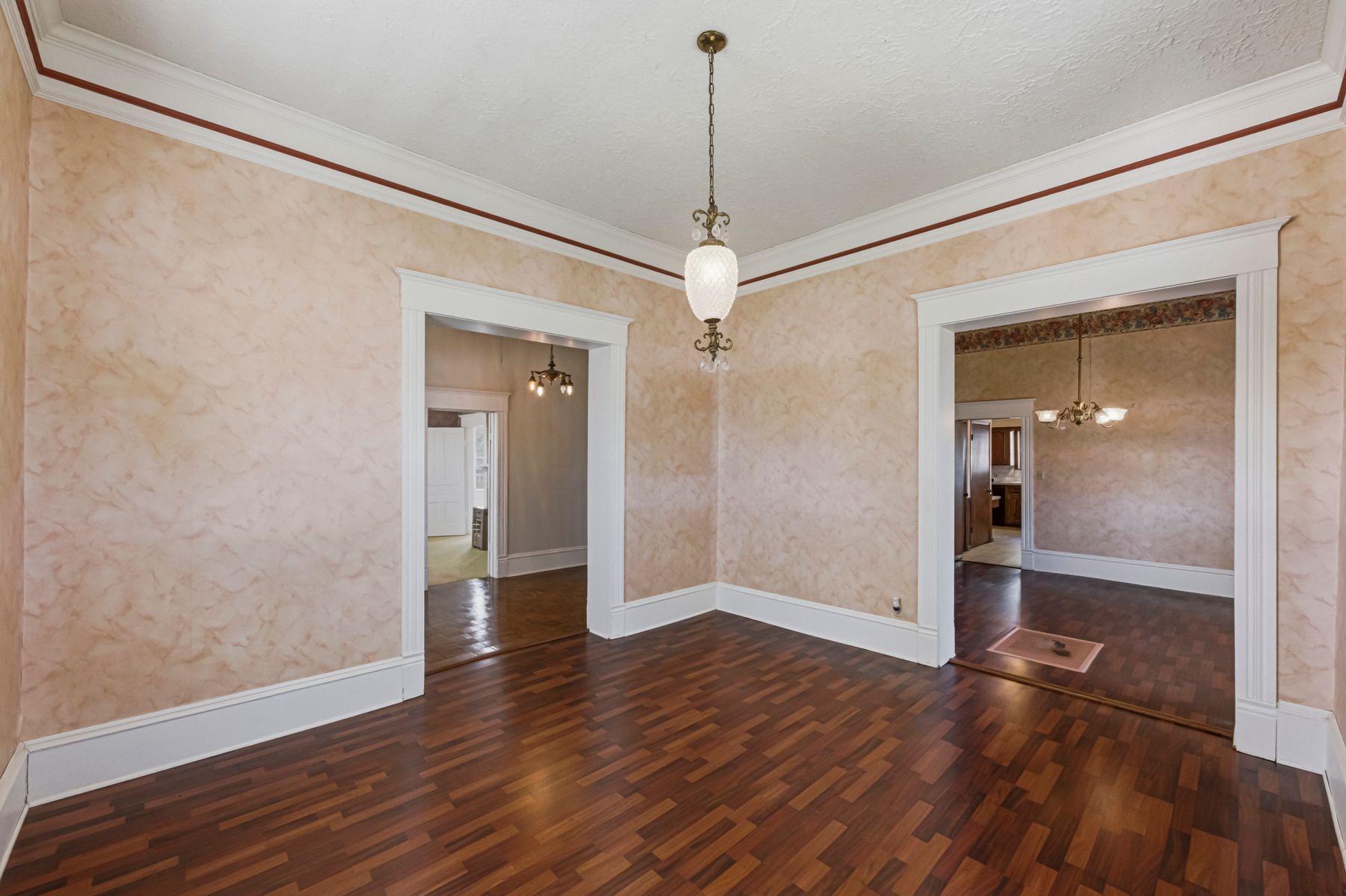 100 West 11th Street Elgin, TX 78621 - Photo 10 of 32 a view of an empty room with wooden floor and a window