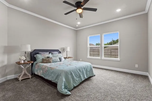 a bedroom with a bed and window