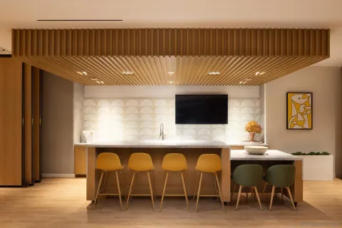 a living room with furniture and large windows