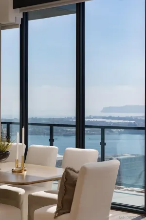 a view of balcony with a large window and wooden floor