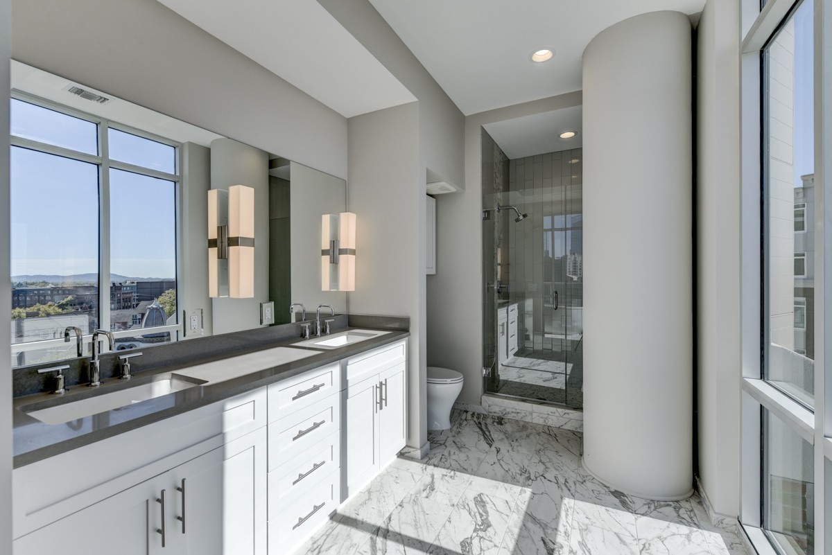 20 Rutledge Street, Unit 601 Nashville, TN 37210 - Photo 11 of 30 a spacious bathroom with a granite countertop sink mirror and double