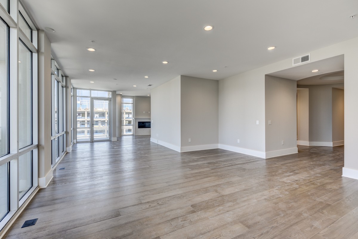 20 Rutledge Street, Unit 601 Nashville, TN 37210 - Photo 13 of 30 an empty room with wooden floor and windows
