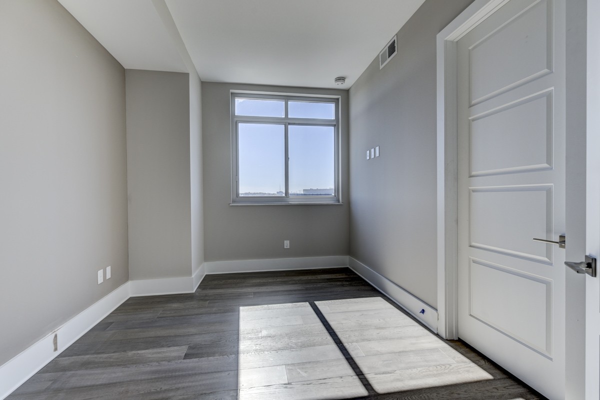20 Rutledge Street, Unit 601 Nashville, TN 37210 - Photo 5 of 30 wooden floor in an empty room with a window