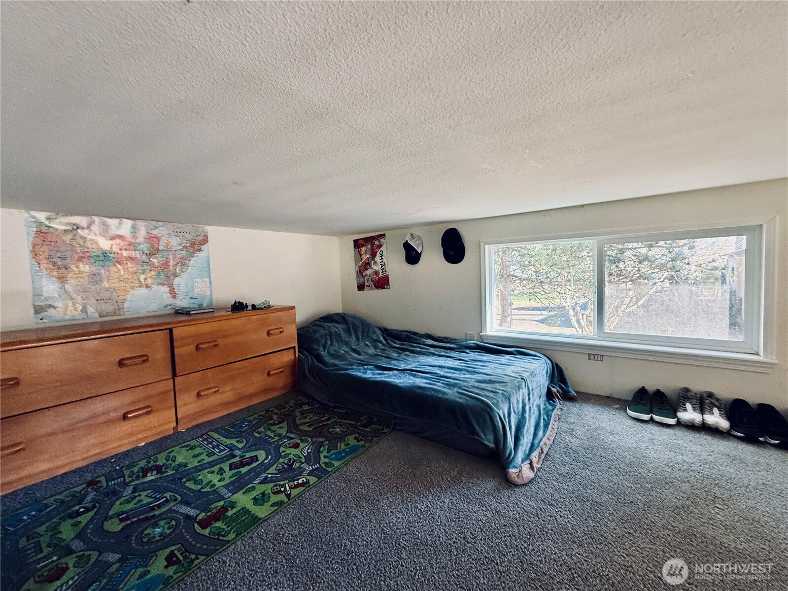 150 Happy Trails Road, Unit 119 Castle Rock, WA 98611 - Photo 12 of 20 a bed room with a bed and a window
