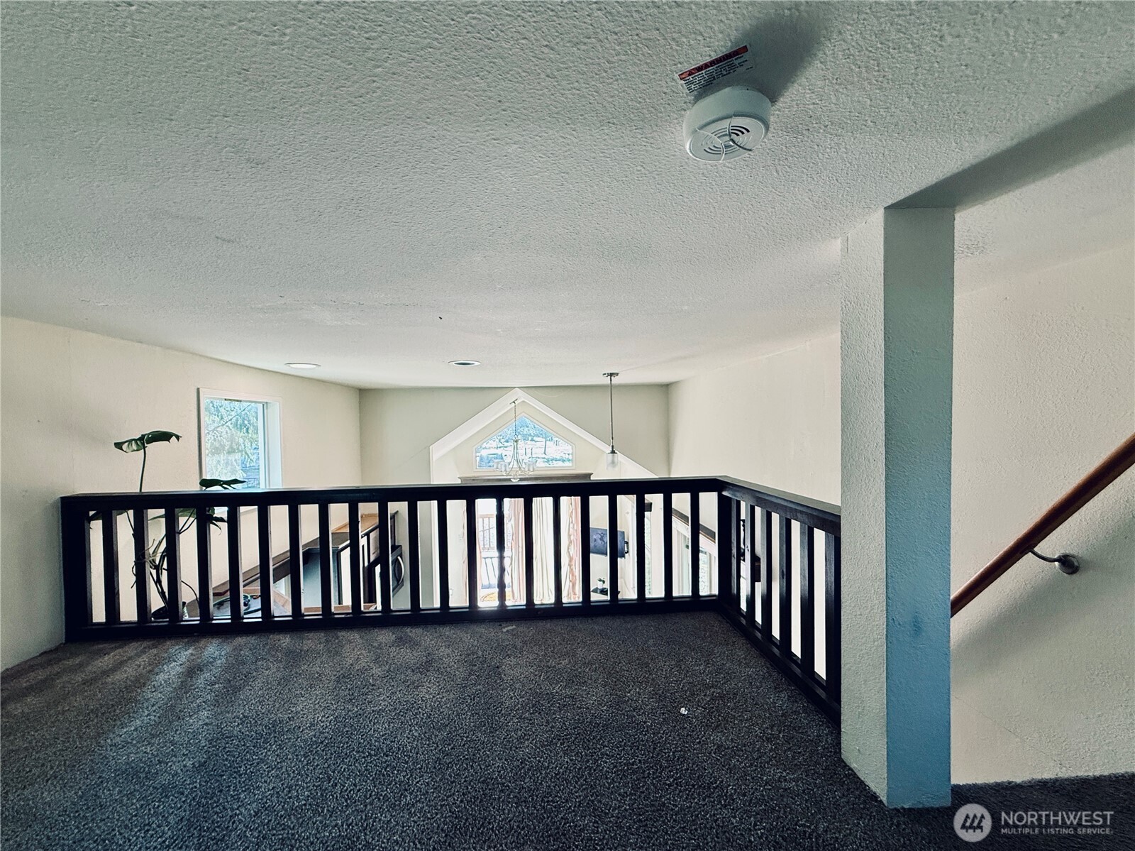 150 Happy Trails Road, Unit 119 Castle Rock, WA 98611 - Photo 13 of 20 a view of a hallway with staircase