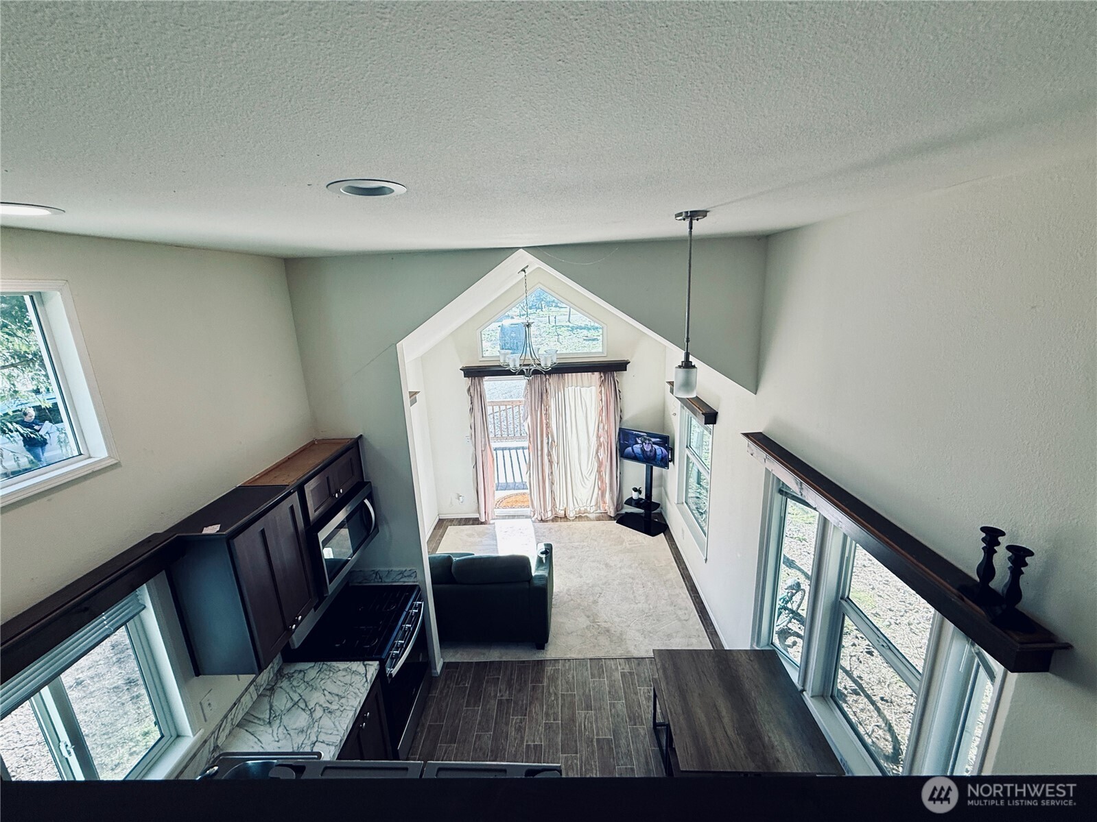 150 Happy Trails Road, Unit 119 Castle Rock, WA 98611 - Photo 14 of 20 a living room with furniture and a window