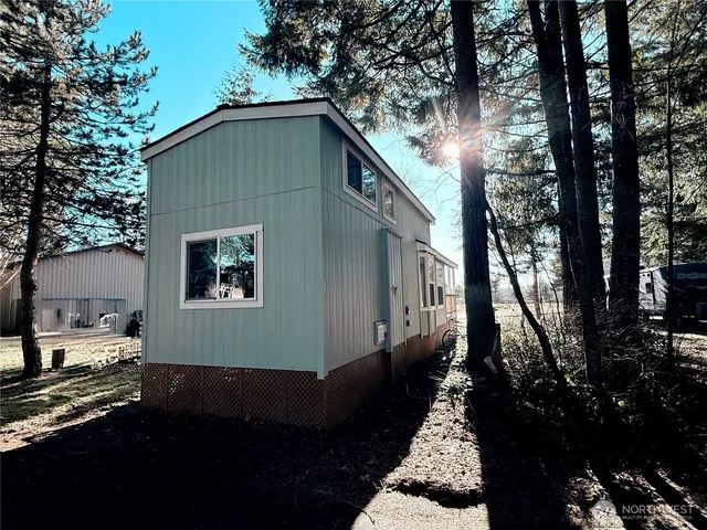 a backyard of a house with lots of green space