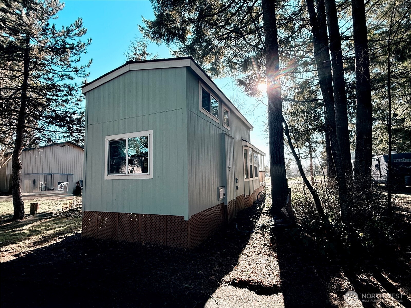 150 Happy Trails Road, Unit 119 Castle Rock, WA 98611 - Photo 15 of 20 a backyard of a house with lots of green space