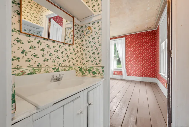 a bathroom with a sink and a mirror