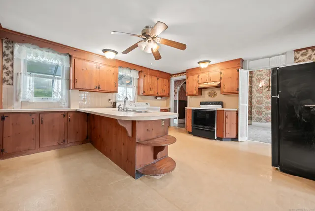 a kitchen with a refrigerator and a sink