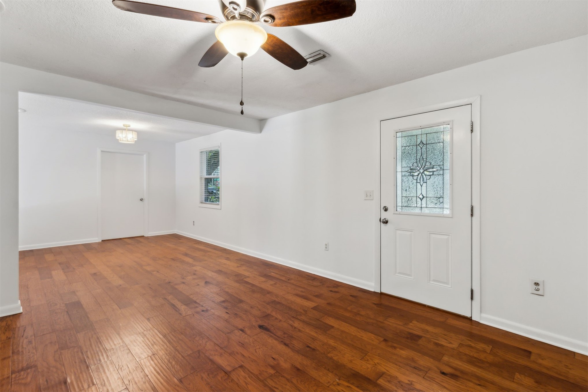 2441 Amelia Road Fernandina Beach, FL 32034 - Photo 6 of 36 a view of empty room with wooden floor