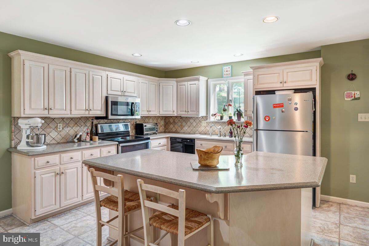 618 Aberdeen Road Kennett Square, PA 19348 - Photo 12 of 36 Induction Range and Corian Countertops