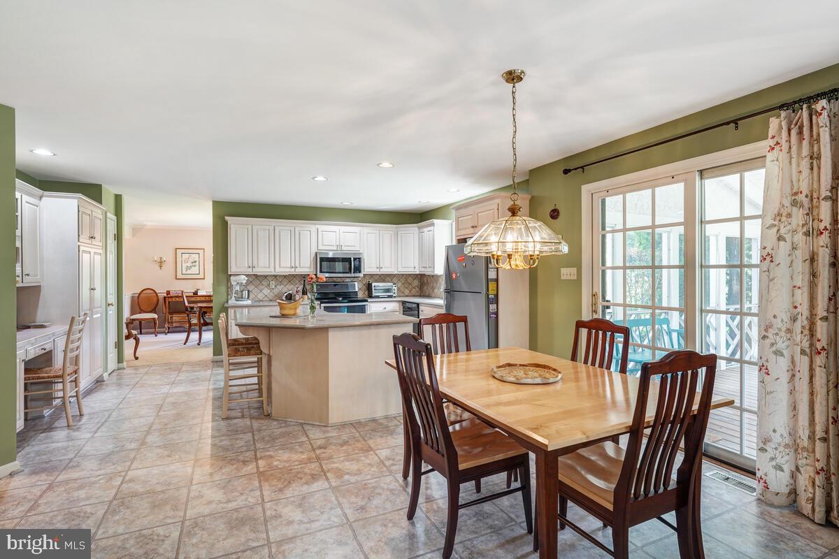 618 Aberdeen Road Kennett Square, PA 19348 - Photo 13 of 36 Eat-In Kitchen w/ Sliders to the Screened-in Porch