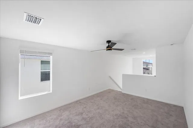 a view of a small space with a fan