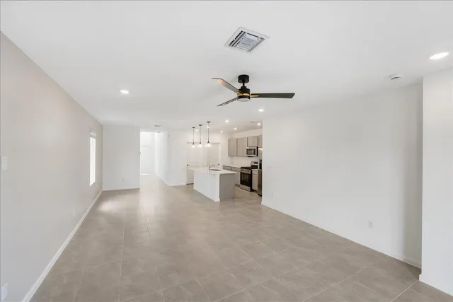 a view of a living room hardwood and a ceiling fan