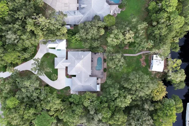 an aerial view of a house with outdoor space