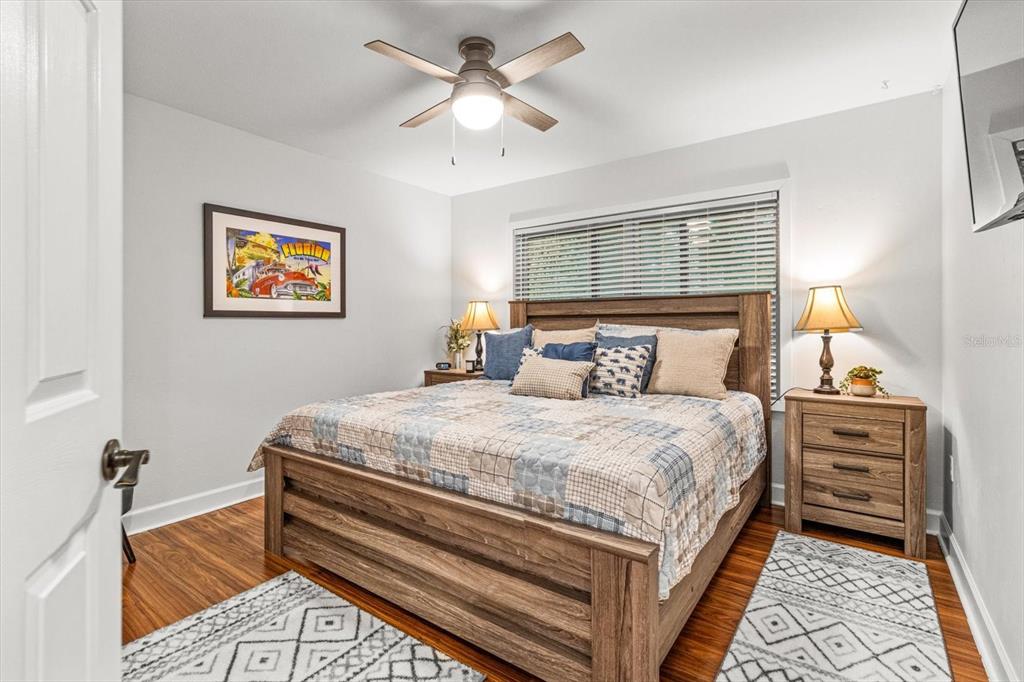 20 Captains Cove Road Inglis, FL 34449 - Photo 36 of 94 a bedroom with a bed and a chandelier