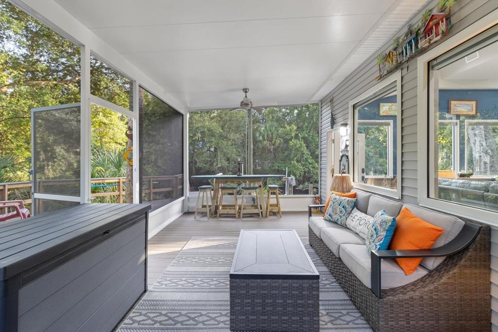 20 Captains Cove Road Inglis, FL 34449 - Photo 73 of 94 a living room with furniture and a large window