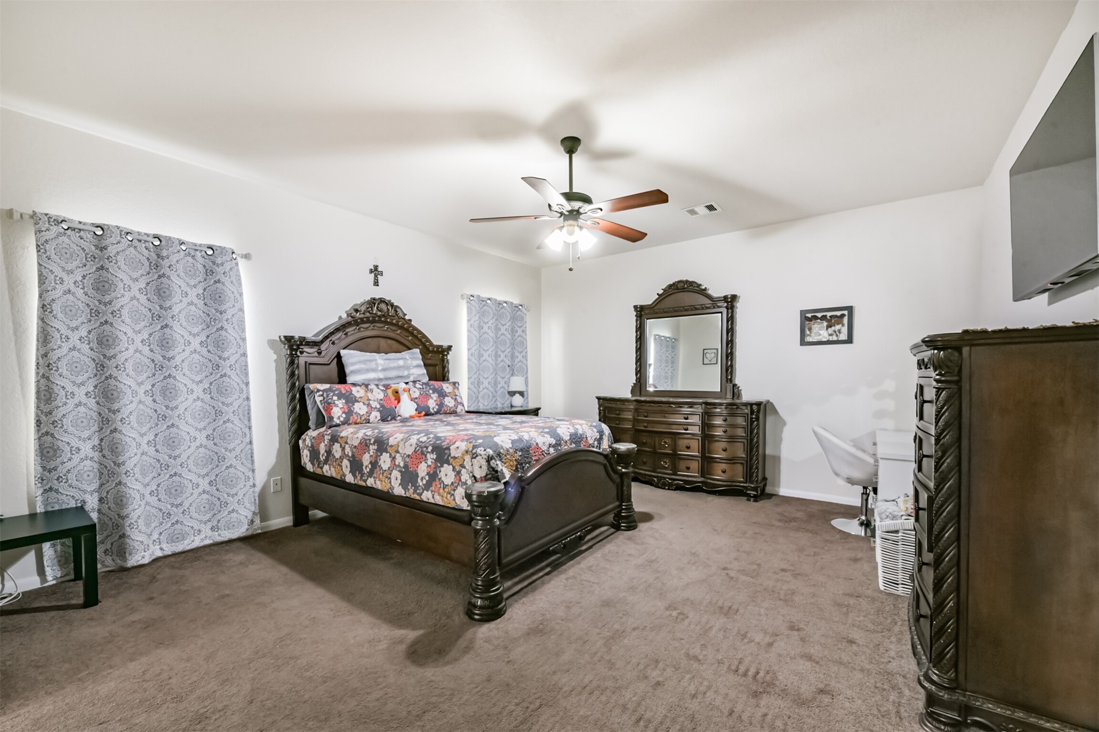 14723 Nickel Plank Road Houston, TX 77049 - Photo 20 of 47 a bedroom with a bed dresser and a window