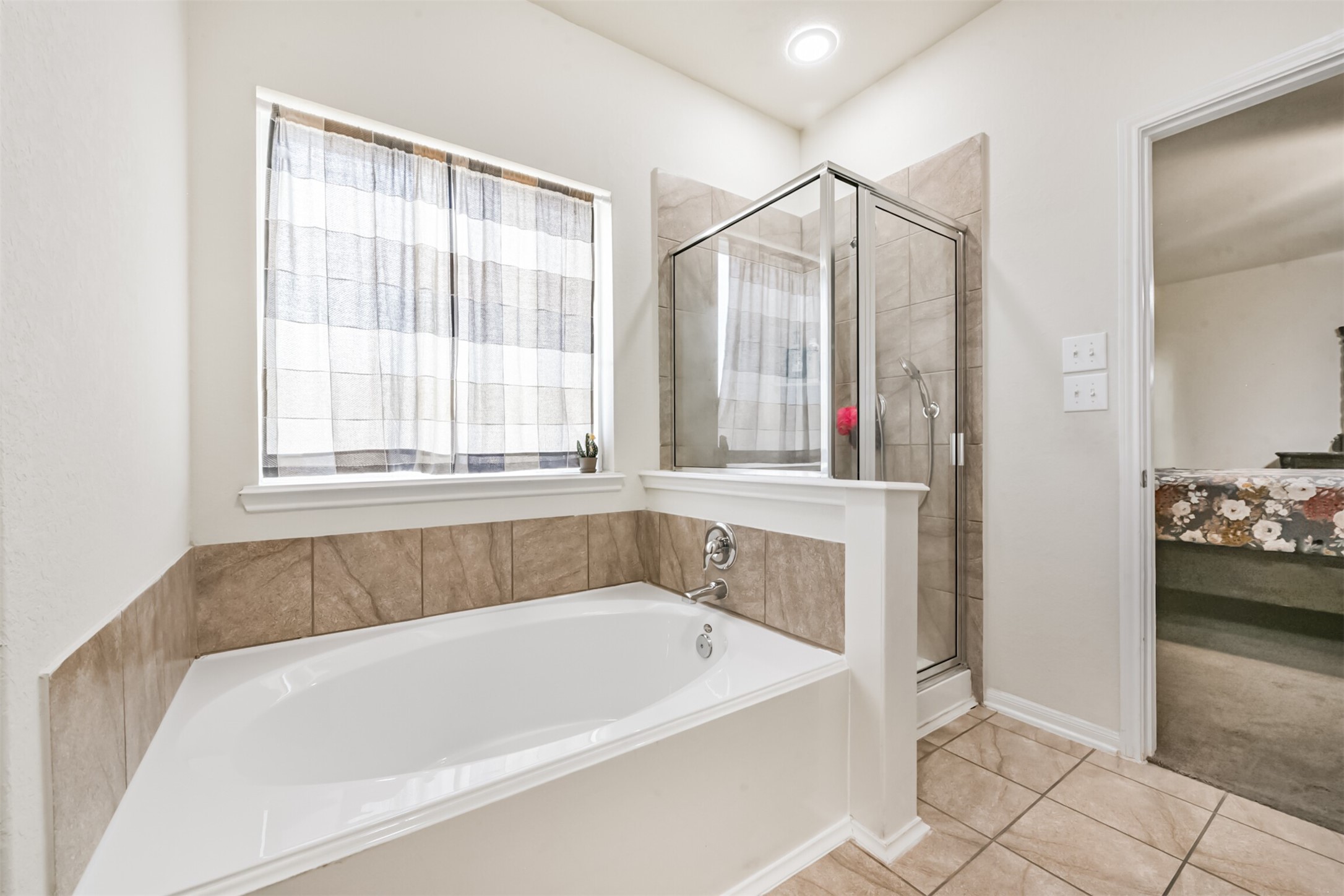 14723 Nickel Plank Road Houston, TX 77049 - Photo 25 of 47 a white bath tub sitting next to a window