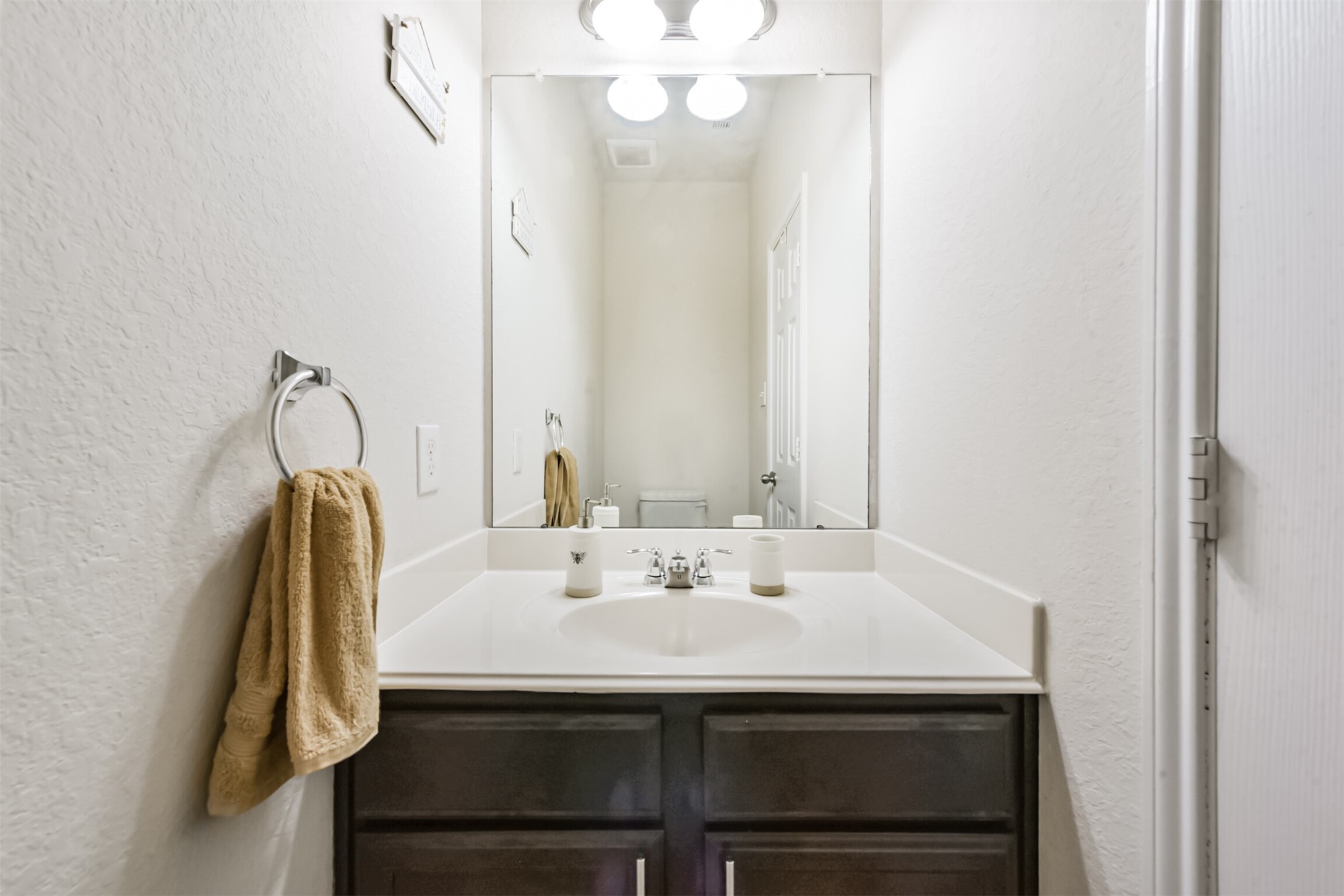 14723 Nickel Plank Road Houston, TX 77049 - Photo 26 of 47 a bathroom with a sink and a mirror