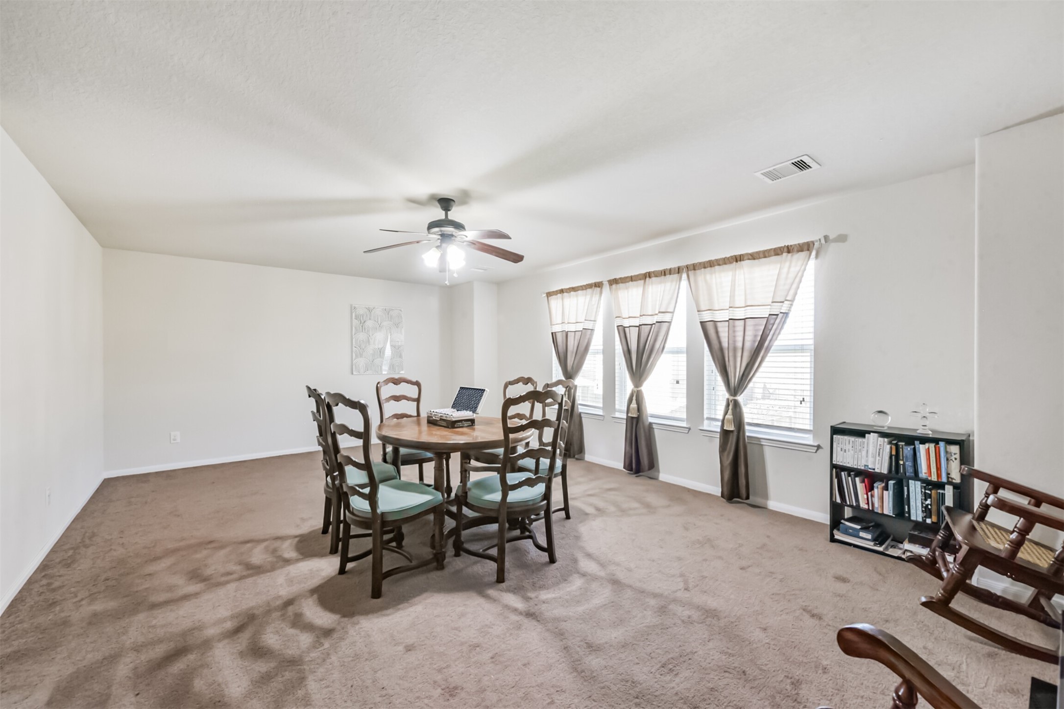 14723 Nickel Plank Road Houston, TX 77049 - Photo 27 of 47 a dining room with furniture and window
