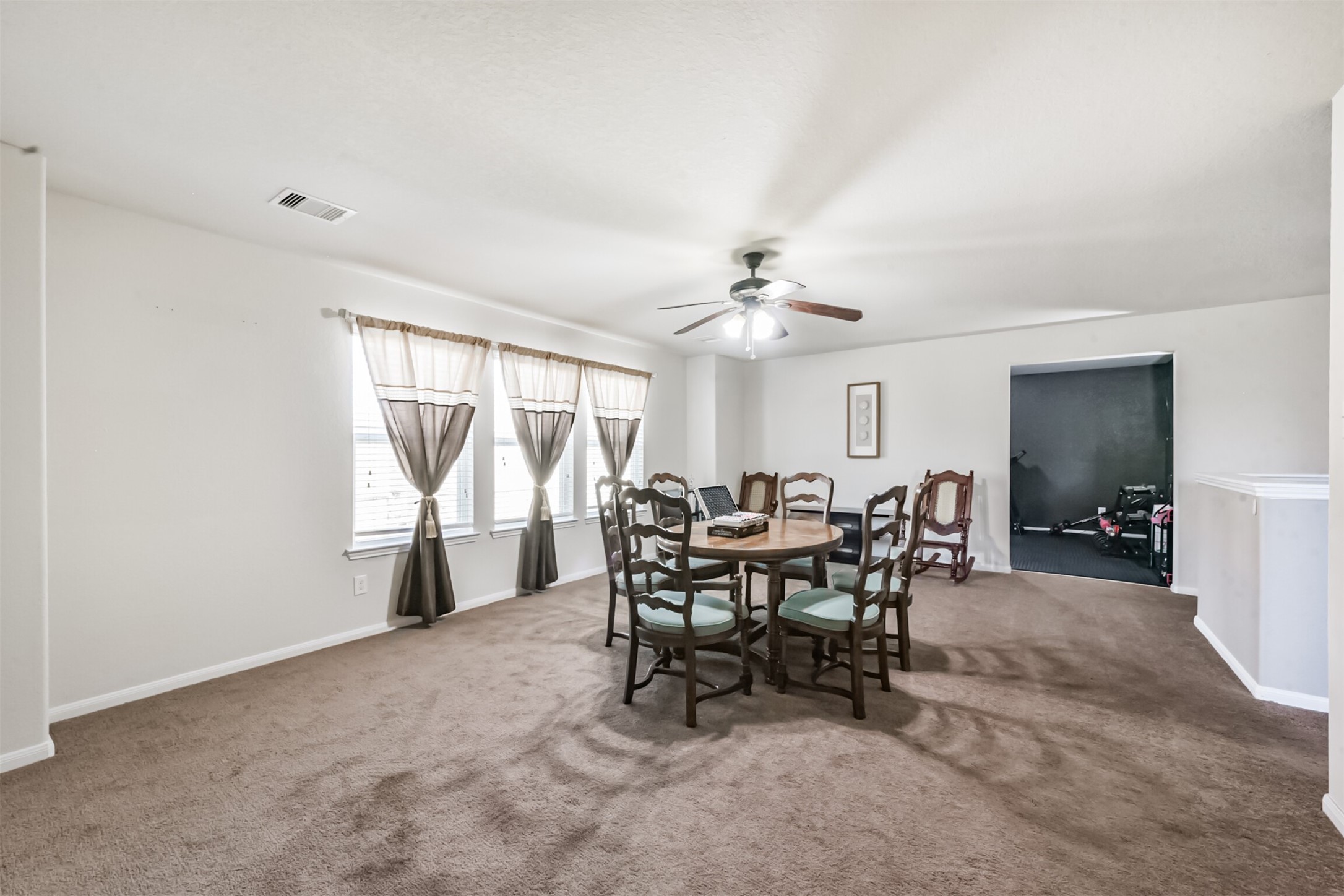 14723 Nickel Plank Road Houston, TX 77049 - Photo 28 of 47 a view of a dining room with furniture and a livingroom