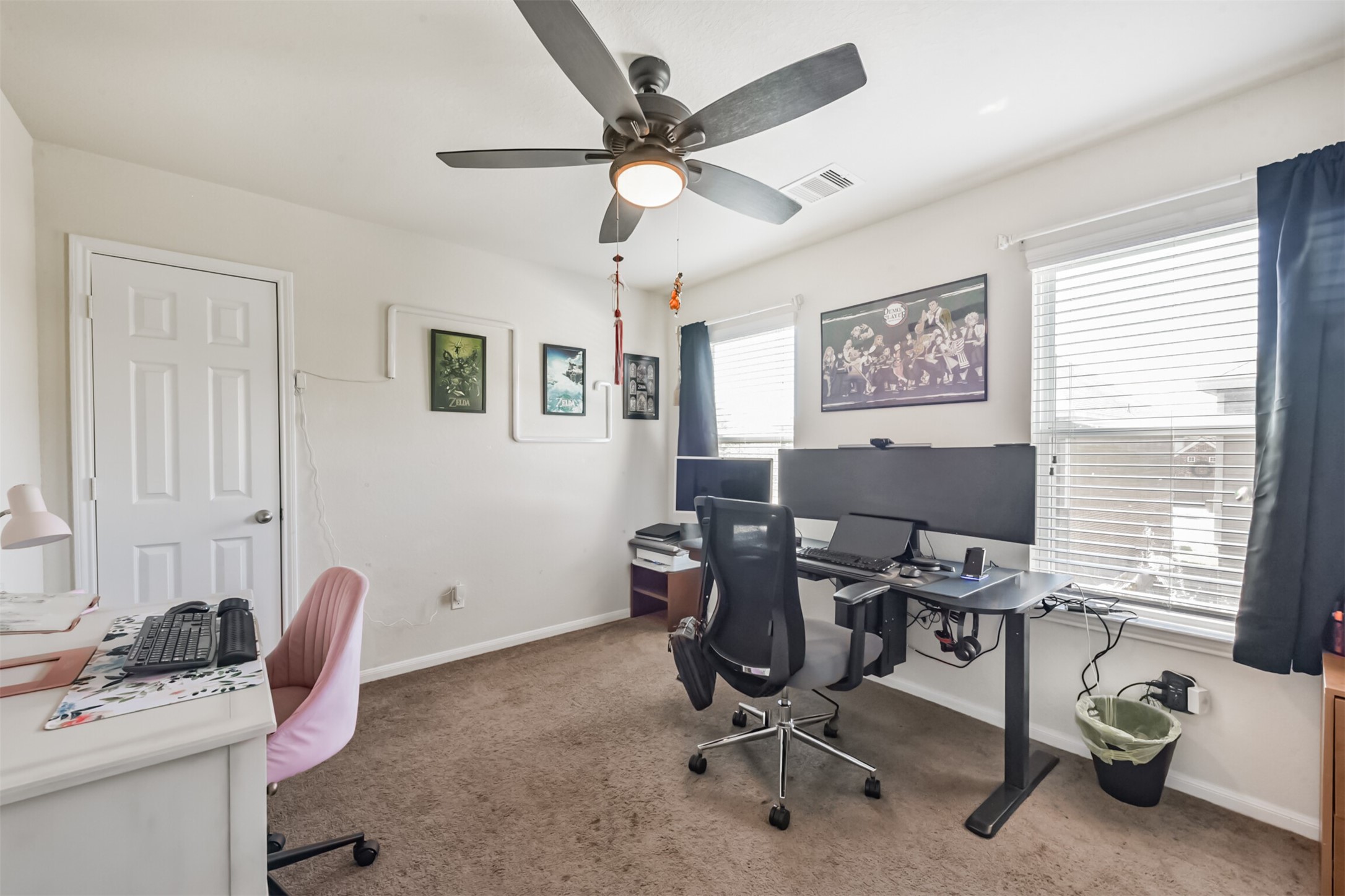 14723 Nickel Plank Road Houston, TX 77049 - Photo 31 of 47 a view of a workspace with furniture and a window