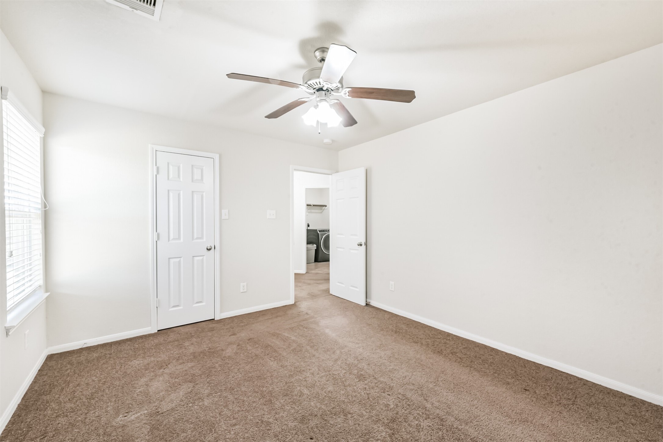 14723 Nickel Plank Road Houston, TX 77049 - Photo 36 of 47 a view of an empty room and chandelier fan