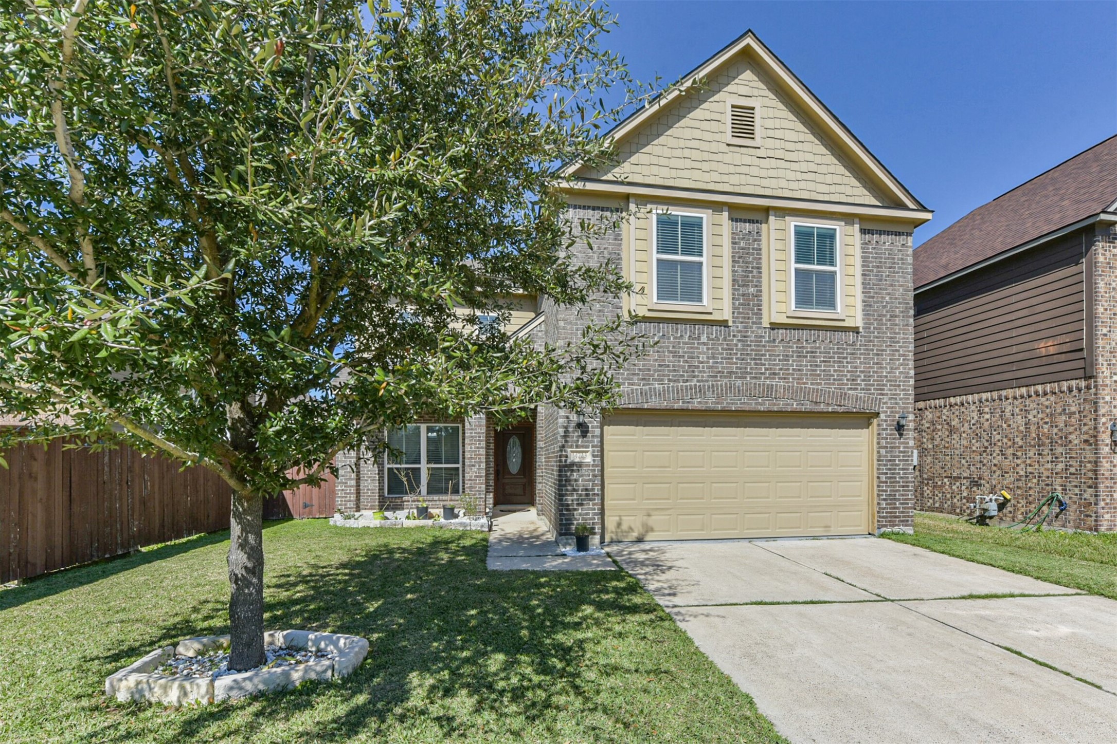 14723 Nickel Plank Road Houston, TX 77049 - Photo 42 of 47 a front view of a house with a yard and garage