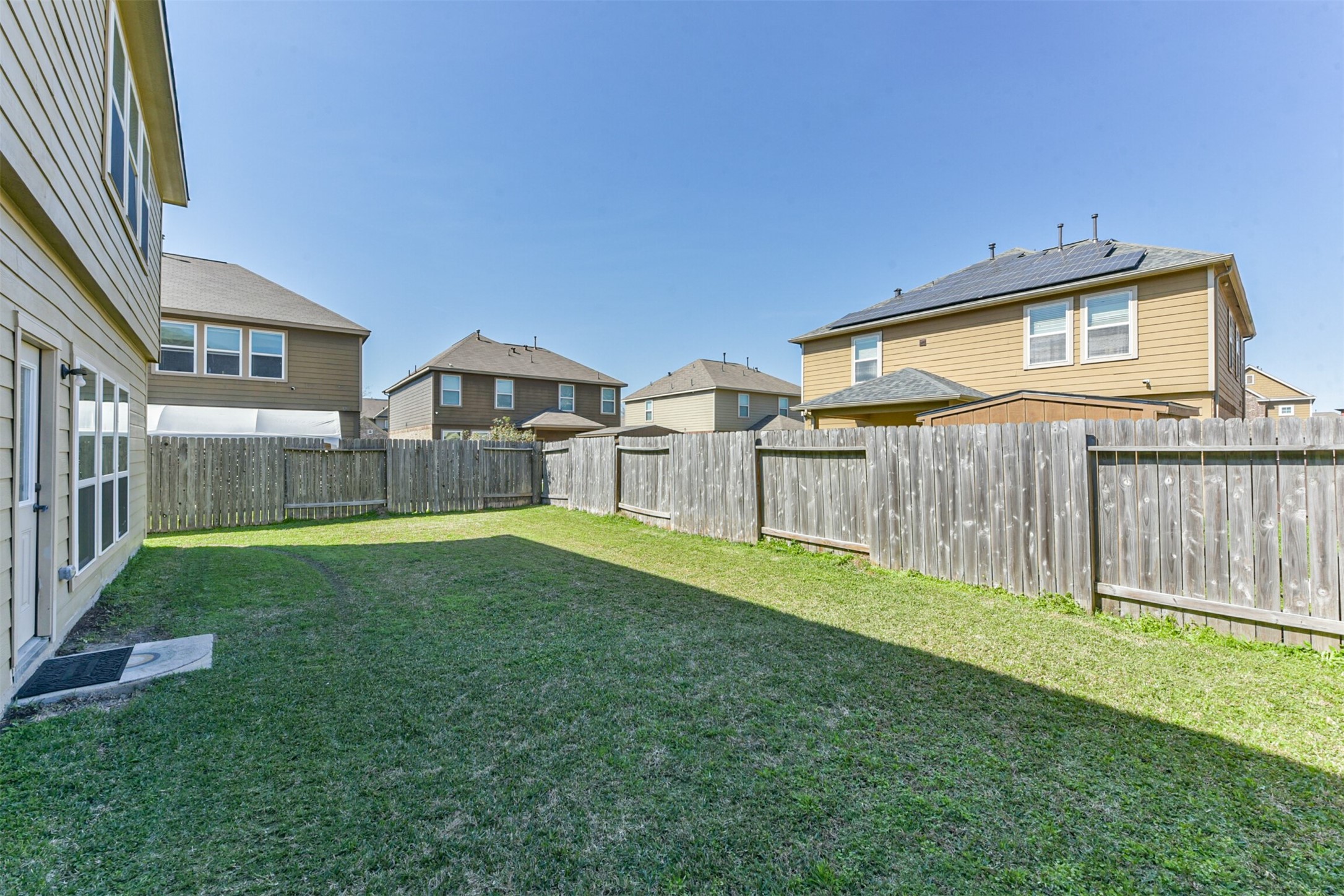 14723 Nickel Plank Road Houston, TX 77049 - Photo 46 of 47 a backyard of a house with wooden fence