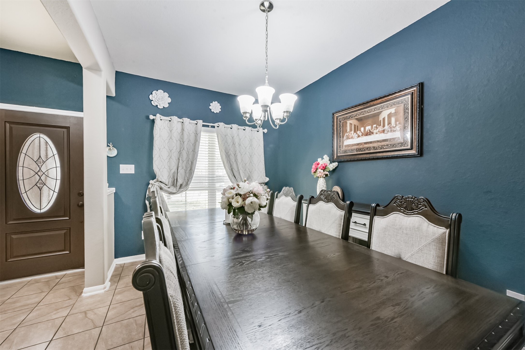 14723 Nickel Plank Road Houston, TX 77049 - Photo 8 of 47 a view of a dining room with furniture and chandelier