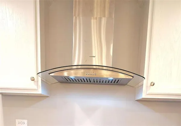 a view of washer and dryer with wooden floor