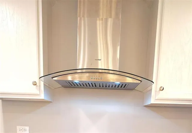 a view of washer and dryer with wooden floor