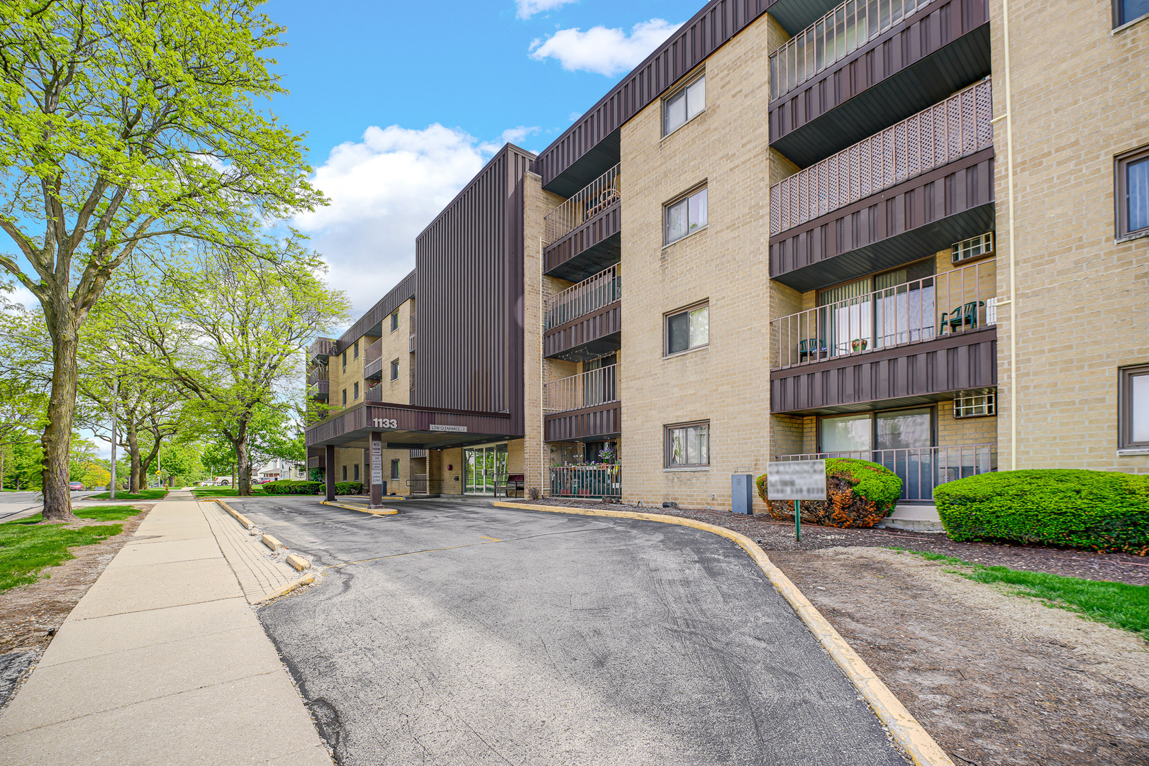 1133 South Finley Road, Unit 310 Lombard, IL 60148 - Photo 27 of 29 a view of a building with a yard