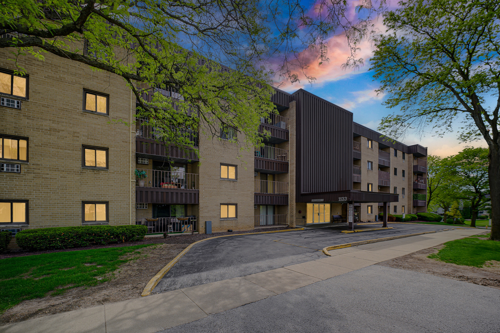 1133 South Finley Road, Unit 310 Lombard, IL 60148 - Photo 29 of 29 a brick building with a tree in front of it