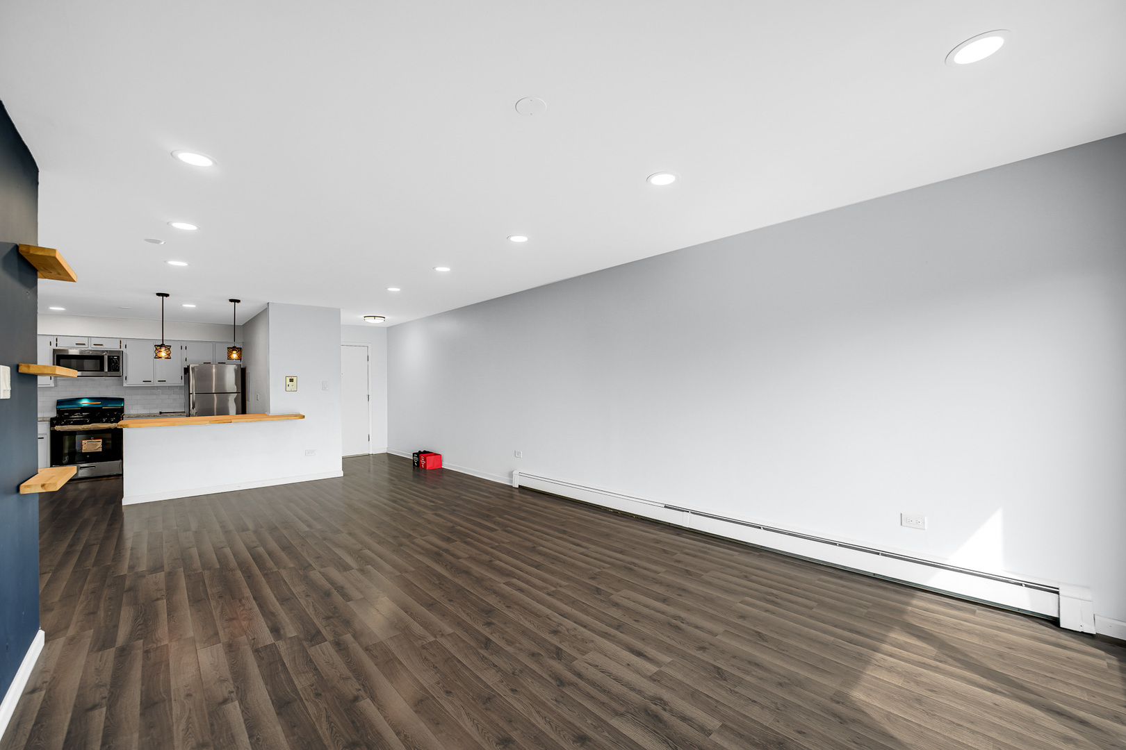 1133 South Finley Road, Unit 310 Lombard, IL 60148 - Photo 7 of 29 a view of a kitchen with wooden floor and an empty space