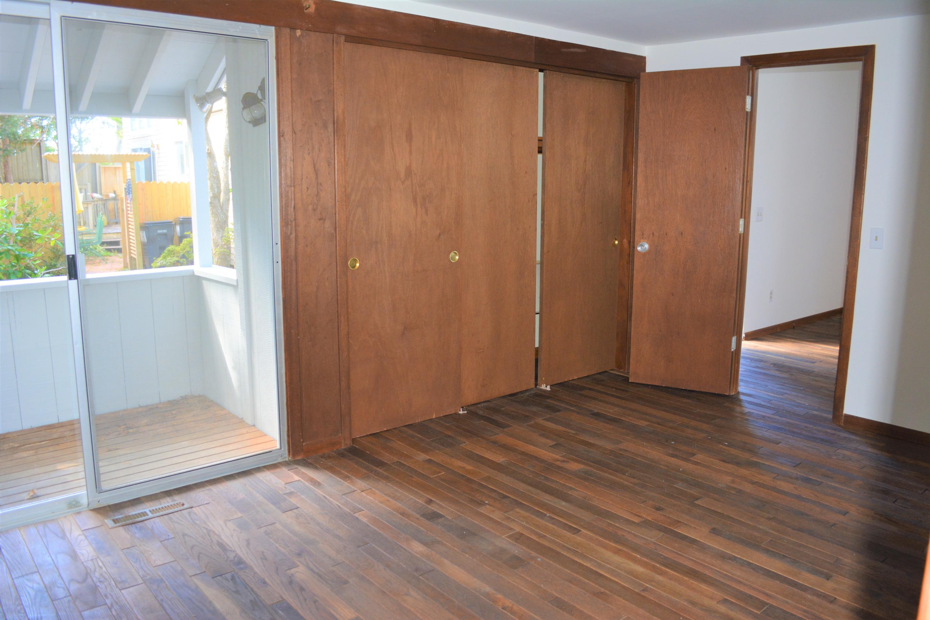 76 Summersea Road Mashpee, MA 02649 - Photo 12 of 24 a view of an empty room with wooden floor and a window