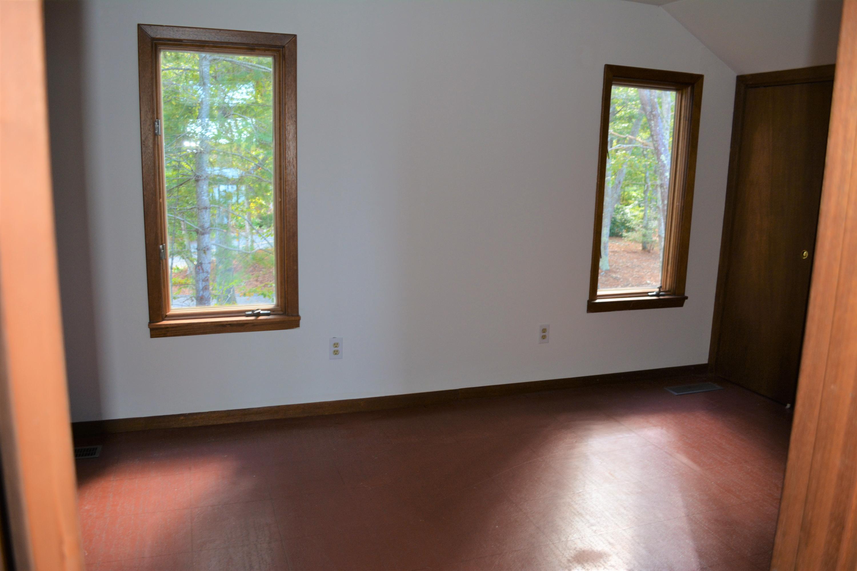 76 Summersea Road Mashpee, MA 02649 - Photo 17 of 24 an empty room with wooden floor and windows