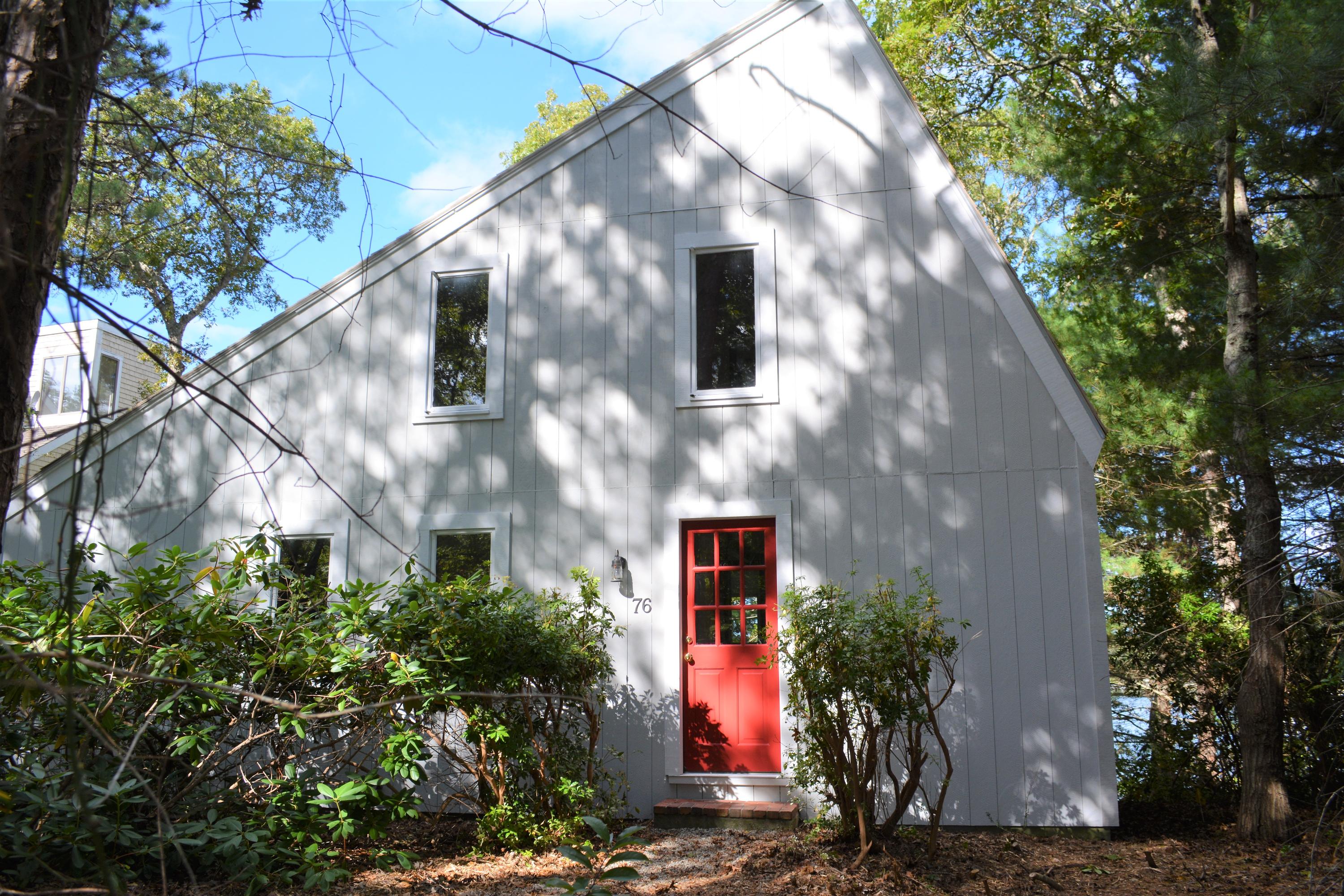 76 Summersea Road Mashpee, MA 02649 - Photo 3 of 24 a front view of a house with a yard