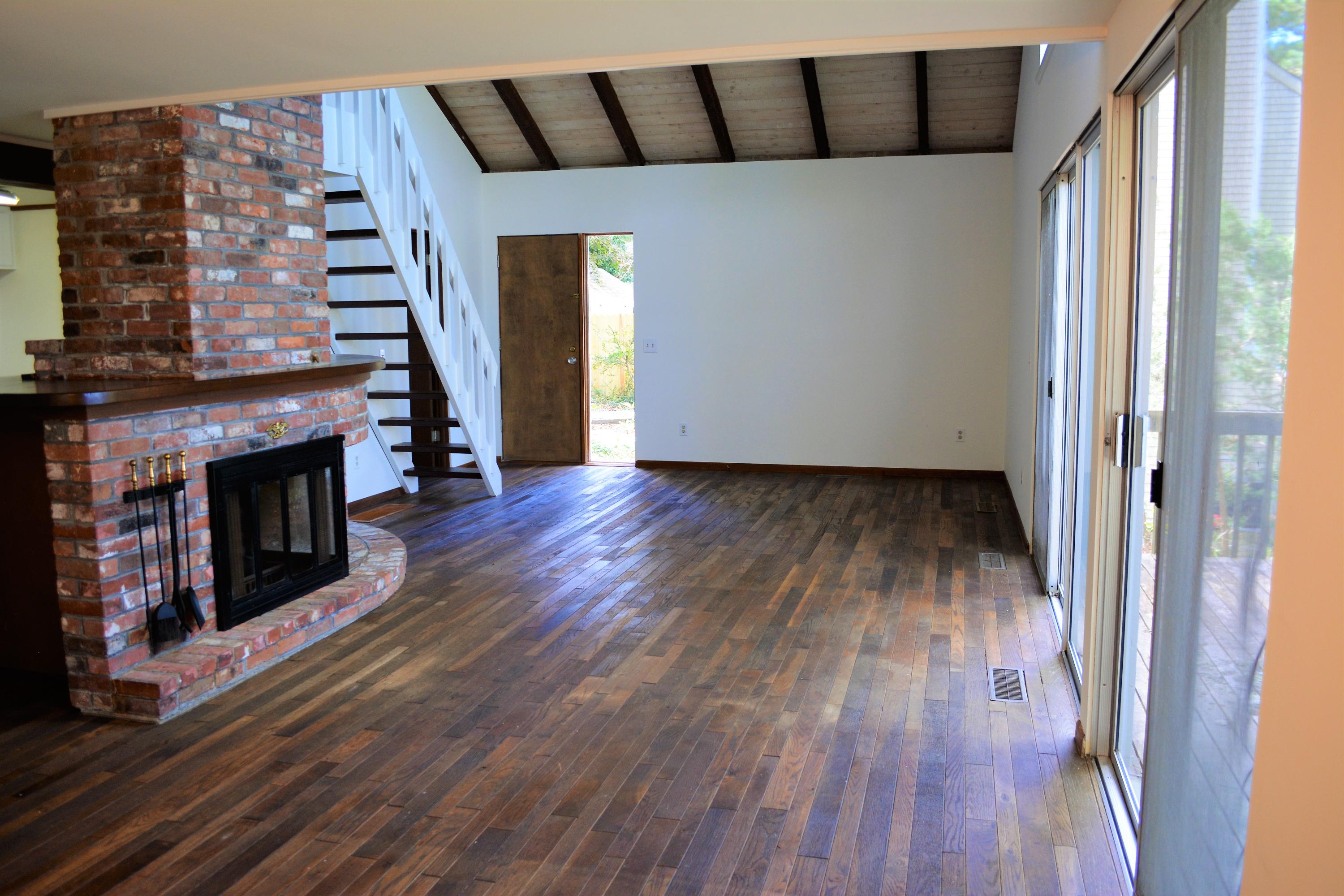 76 Summersea Road Mashpee, MA 02649 - Photo 7 of 24 a view of a livingroom with wooden floor and a fireplace