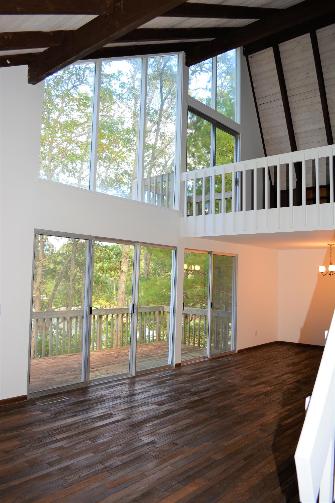 76 Summersea Road Mashpee, MA 02649 - Photo 8 of 24 a view of an empty room with wooden floor and a window