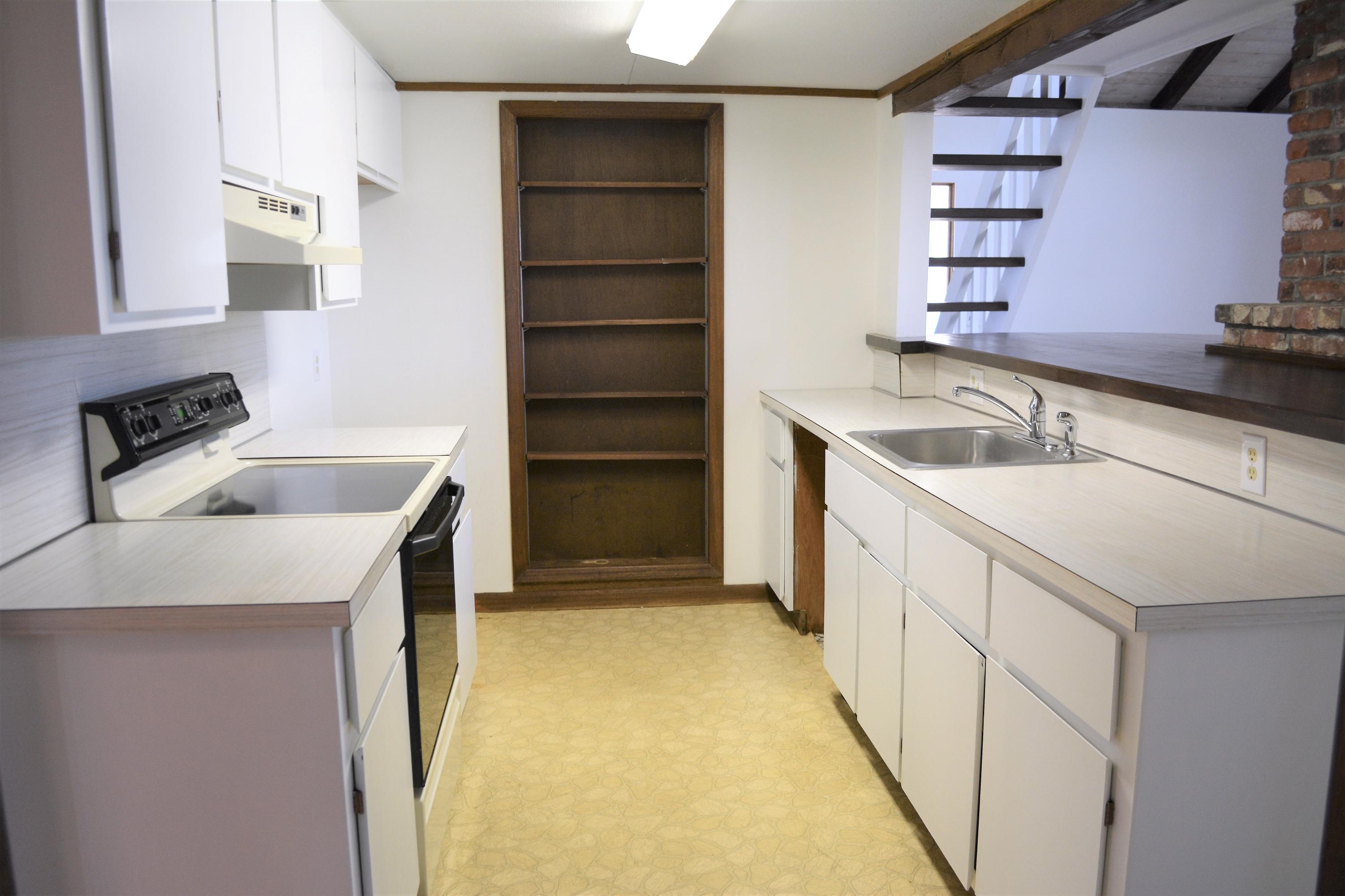76 Summersea Road Mashpee, MA 02649 - Photo 10 of 24 a kitchen with a sink and cabinets