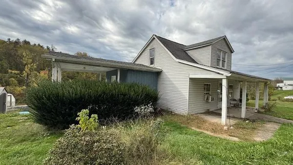 a backyard of a house with lots of green space