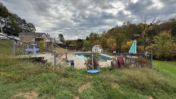 a backyard of a house with lots of green space