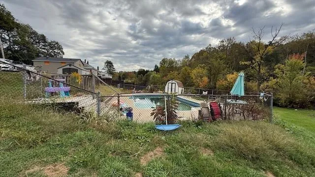 a backyard of a house with lots of green space